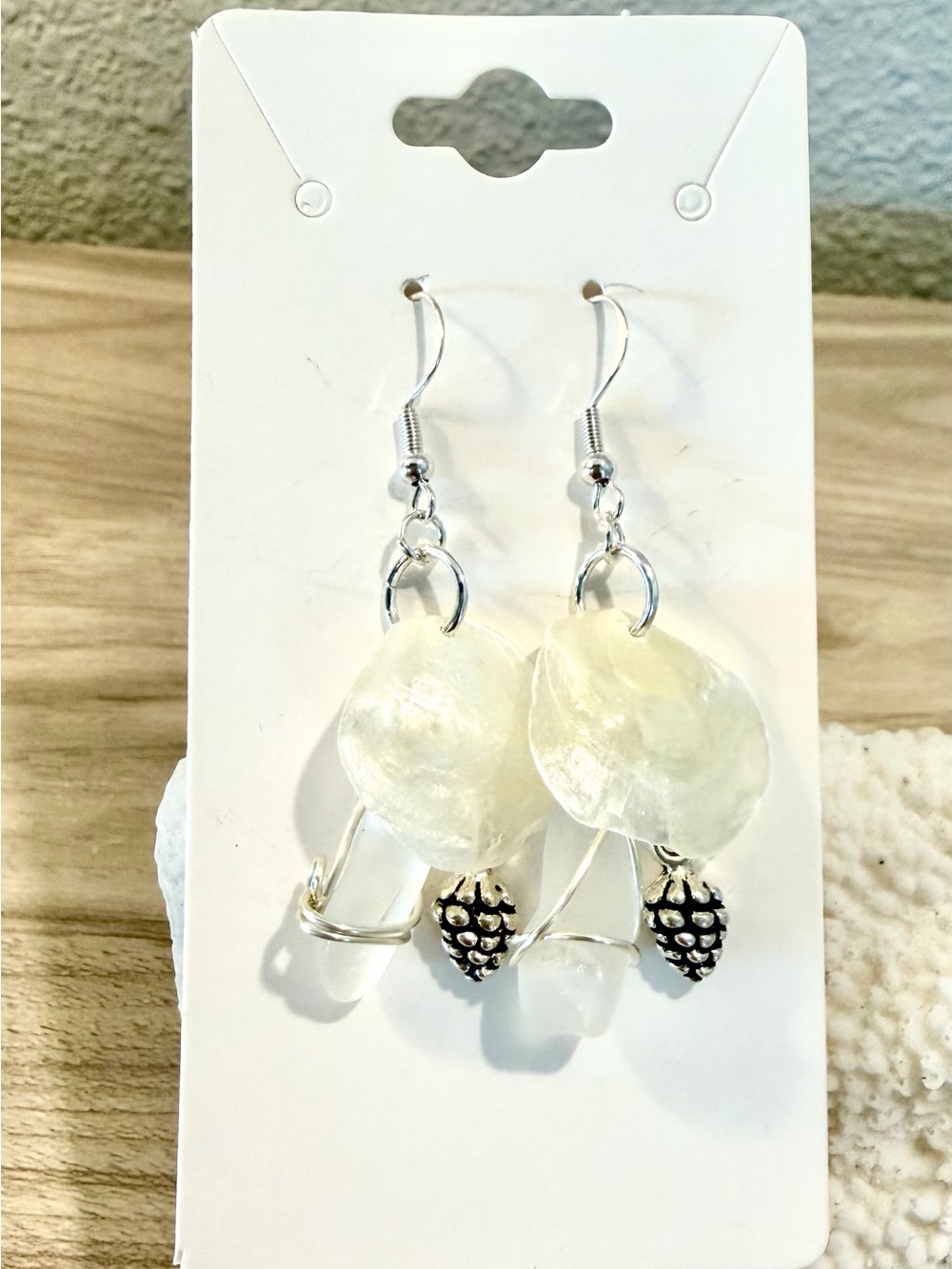 136. Handmade White jingle Shell Earrings with pine cone Accents